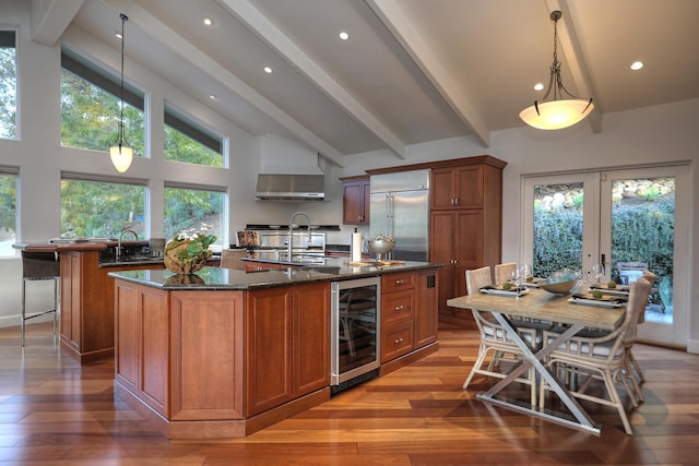 62 Canon View Rd, Montecito, CA 93108 - kitchen featuring beverage cooler, stainless steel built in refrigerator, an island with sink, beamed ceiling, and brown cabinetry
