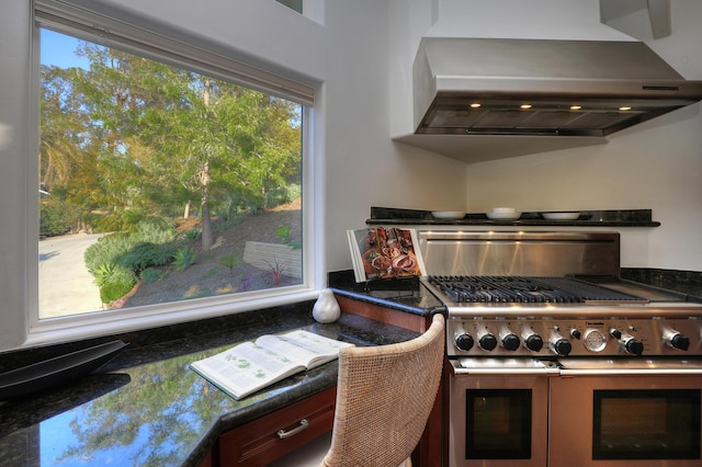 62 Canon View Rd, Montecito, CA 93108 - kitchen with wall chimney range hood, double oven range, plenty of natural light, and dark countertops