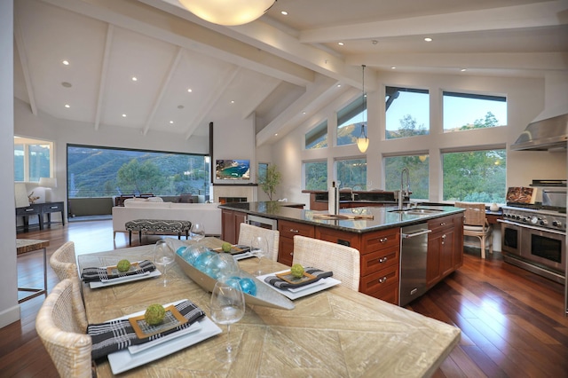 62 Canon View Rd, Montecito, CA 93108 - kitchen featuring a sink, stainless steel appliances, a kitchen island with sink, beam ceiling, and dark wood-type flooring