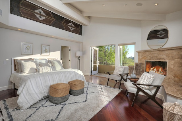 62 Canon View Rd, Montecito, CA 93108 - bedroom featuring baseboards, a towering ceiling, wood finished floors, beamed ceiling, and a stone fireplace