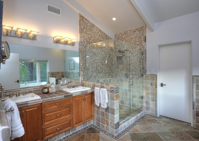 62 Canon View Rd, Montecito, CA 93108 - bathroom featuring a shower stall, double vanity, stone finish floors, and beamed ceiling
