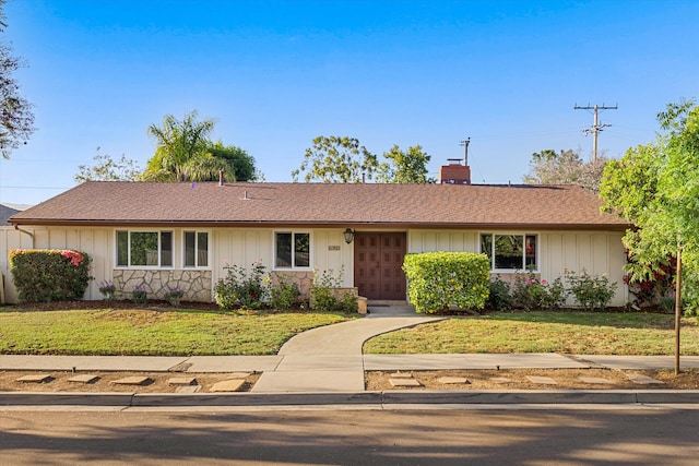 4634 Puente Plz, Santa Barbara, CA 93110 - ranch-style house with a chimney, a front yard, and board and batten siding