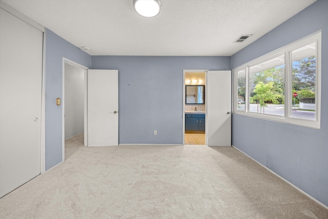 4634 Puente Plz, Santa Barbara, CA 93110 - empty room featuring carpet and a textured ceiling