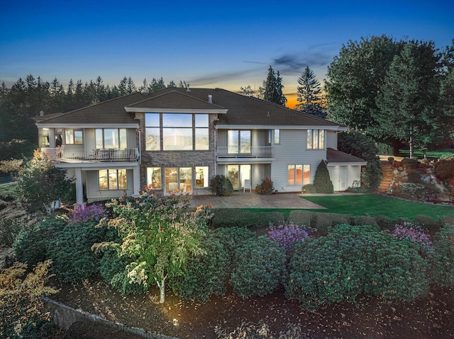 11719 SE Solomon Ct, Happy Valley, OR 97086 - rear view of house featuring a balcony and a lawn