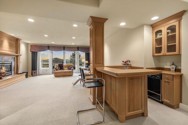 11719 SE Solomon Ct, Happy Valley, OR 97086 - indoor wet bar with light carpet, black dishwasher, recessed lighting, and a fireplace