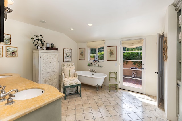 4451 Via Alegre, Santa Barbara, CA 93110 - full bath featuring a freestanding bath, double vanity, recessed lighting, tile patterned flooring, and vaulted ceiling
