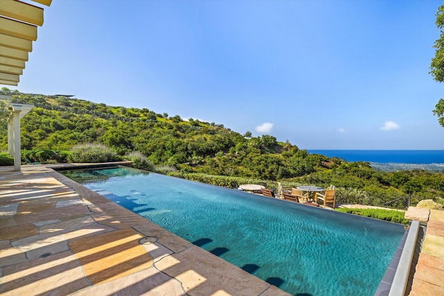 892 Toro Canyon Rd, Montecito, CA 93108 - view of swimming pool with an infinity pool and a patio area