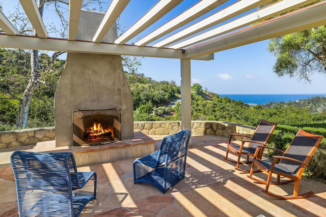 892 Toro Canyon Rd, Montecito, CA 93108 - view of patio / terrace featuring a large fireplace and a pergola