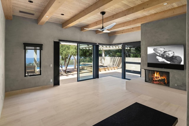892 Toro Canyon Rd, Montecito, CA 93108 - empty room with a wooden ceiling with exposed beams, ceiling fan, a fireplace, and wood finished floors