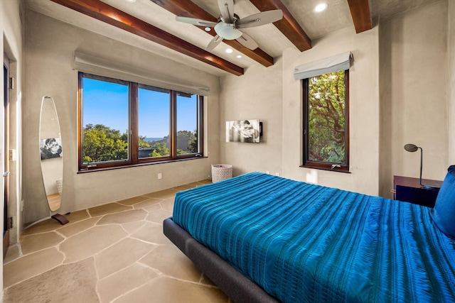892 Toro Canyon Rd, Montecito, CA 93108 - bedroom with beamed ceiling, stone floors, recessed lighting, and ceiling fan