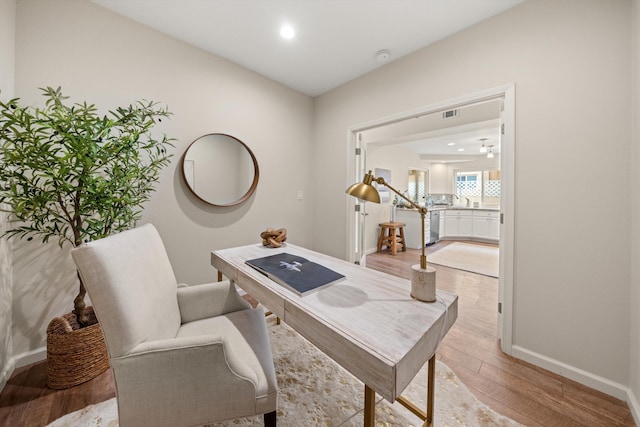 7134 Phelps Rd, Goleta, CA 93117 - office area featuring light wood-type flooring, baseboards, recessed lighting, and a sink