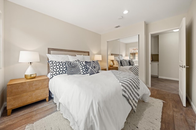 7134 Phelps Rd, Goleta, CA 93117 - bedroom featuring wood finished floors, a closet, recessed lighting, and baseboards