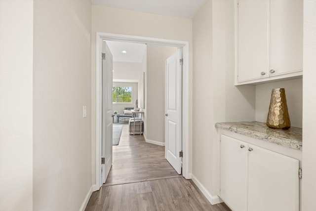 7134 Phelps Rd, Goleta, CA 93117 - hallway with light wood-style floors and baseboards