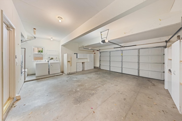 7134 Phelps Rd, Goleta, CA 93117 - garage with white refrigerator with ice dispenser, washing machine and dryer, and a garage door opener