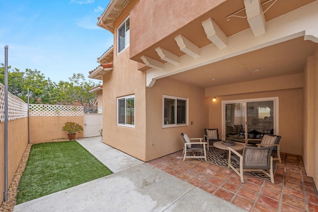 7134 Phelps Rd, Goleta, CA 93117 - fenced backyard with a patio area and outdoor lounge area