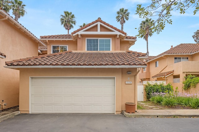 7134 Phelps Rd, Goleta, CA 93117 - view of front of property with asphalt driveway, stucco siding, and a tiled roof