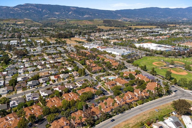 7134 Phelps Rd, Goleta, CA 93117 - aerial overview of property's location featuring a mountainous background, nearby suburban area, and a golf course