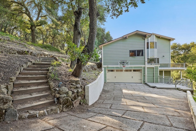 5150 E Camino Cielo, Santa Barbara, CA 93105 - view of side of home featuring stairway, a garage, and driveway