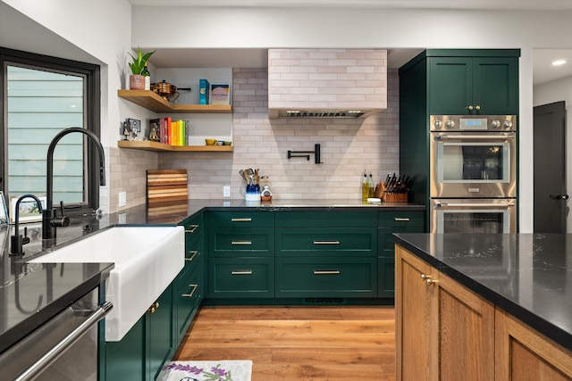 5150 E Camino Cielo, Santa Barbara, CA 93105 - kitchen featuring green cabinetry, double oven, a sink, light wood-style flooring, and recessed lighting