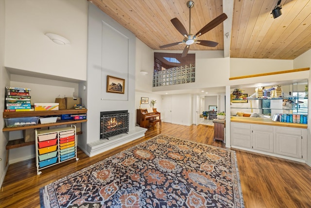5150 E Camino Cielo, Santa Barbara, CA 93105 - living area featuring wooden ceiling, ceiling fan, wood finished floors, a lit fireplace, and high vaulted ceiling