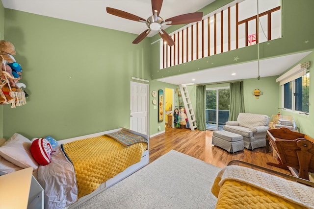 5150 E Camino Cielo, Santa Barbara, CA 93105 - bedroom featuring wood finished floors, a high ceiling, access to exterior, baseboards, and recessed lighting