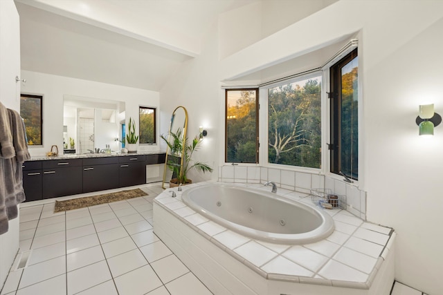 5150 E Camino Cielo, Santa Barbara, CA 93105 - full bathroom with vanity, a jetted tub, vaulted ceiling, and tile patterned floors