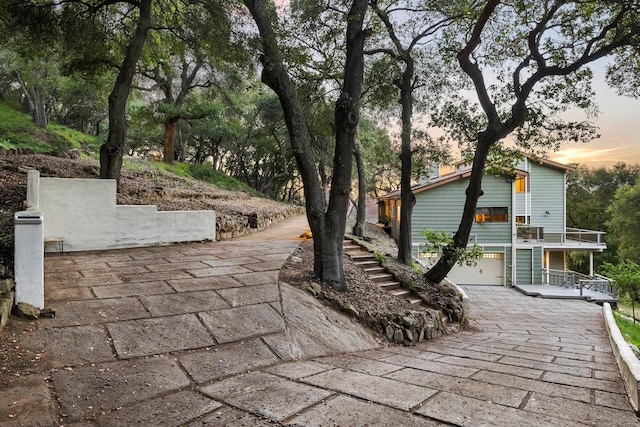 5150 E Camino Cielo, Santa Barbara, CA 93105 - view of patio / terrace with stairs, driveway, and an attached garage