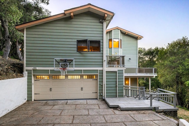 5150 E Camino Cielo, Santa Barbara, CA 93105 - back of property with a garage, asphalt driveway, and a wooden deck