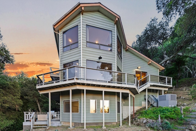 5150 E Camino Cielo, Santa Barbara, CA 93105 - back of property at dusk featuring a balcony