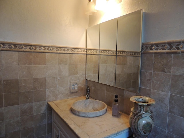 1307 San Andres St, Santa Barbara, CA 93101 - bathroom with tile walls, vanity, and a wainscoted wall