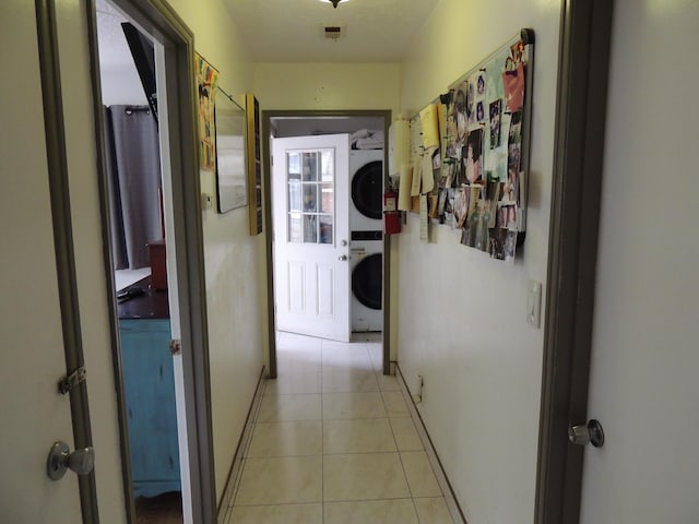 1307 San Andres St, Santa Barbara, CA 93101 - corridor with stacked washing machine and dryer and light tile patterned floors