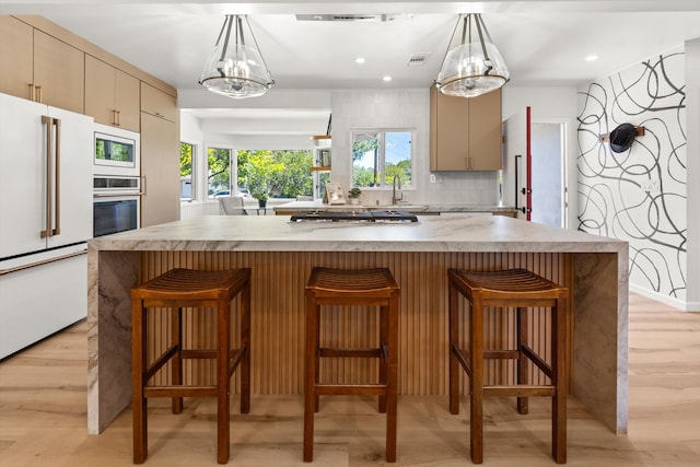1570 Mountain View Dr, Solvang, CA 93463 - kitchen with appliances with stainless steel finishes, a sink, a chandelier, light wood-type flooring, and recessed lighting