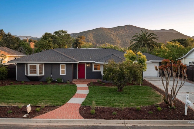 1570 Mountain View Dr, Solvang, CA 93463 - ranch-style home with concrete driveway, a garage, and a mountain view