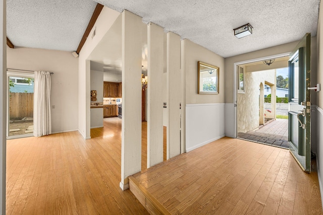 4595 Aragon Dr, Carpinteria, CA 93013 - hall featuring light wood-type flooring and a textured ceiling