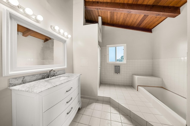 4595 Aragon Dr, Carpinteria, CA 93013 - bathroom featuring tile patterned floors, wood ceiling, vanity, a bath, and tile walls