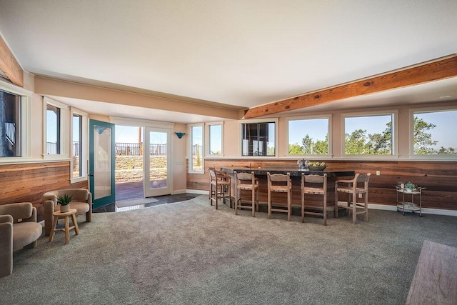 1110 Deer Canyon Rd, Arroyo Grande, CA 93420 - dining area featuring wood walls, carpet, baseboards, and beam ceiling