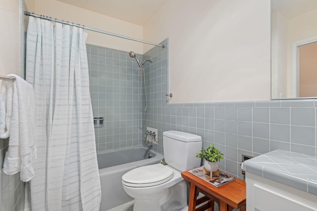 2641 State St Unit 2, Santa Barbara, CA 93105 - bathroom featuring vanity, shower / bath combination with curtain, toilet, and tile walls