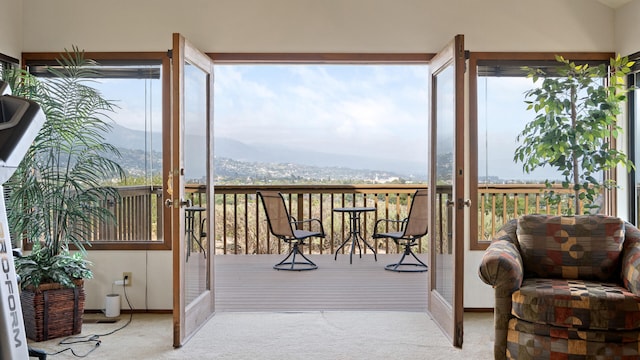 1010 Portesuello Ave, Santa Barbara, CA 93105 - doorway to outside featuring carpet flooring, healthy amount of natural light, a mountain view, and baseboards