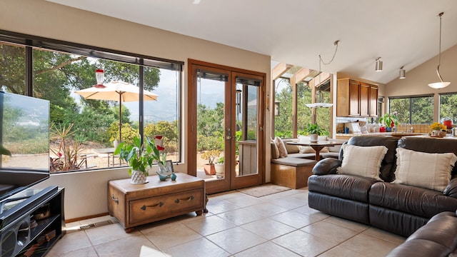 1010 Portesuello Ave, Santa Barbara, CA 93105 - living room with french doors, light tile patterned flooring, plenty of natural light, and lofted ceiling