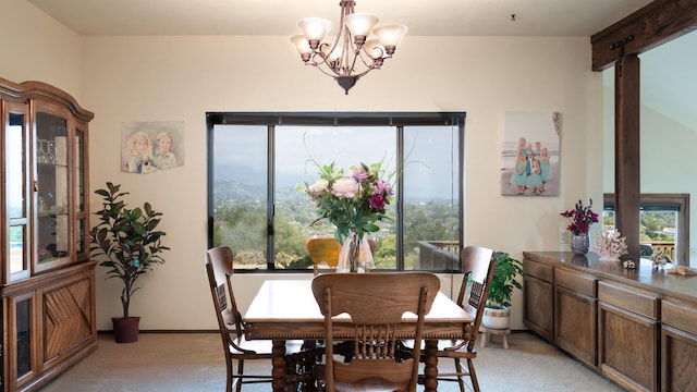 1010 Portesuello Ave, Santa Barbara, CA 93105 - dining area featuring light colored carpet, healthy amount of natural light, and a chandelier