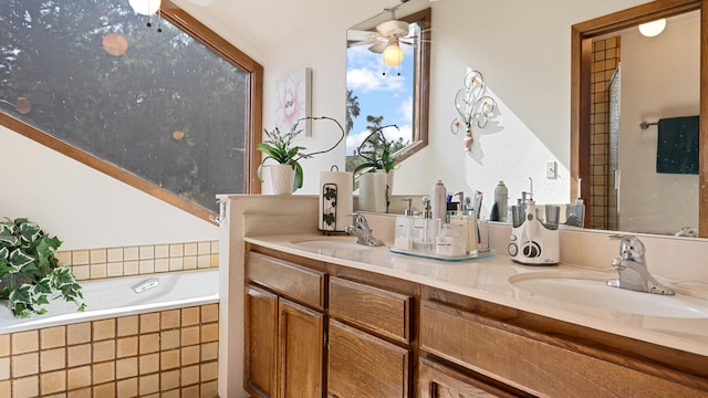 1010 Portesuello Ave, Santa Barbara, CA 93105 - full bathroom featuring a ceiling fan, double vanity, and tiled tub
