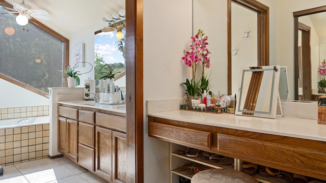 1010 Portesuello Ave, Santa Barbara, CA 93105 - bathroom featuring tile patterned flooring, double vanity, tiled tub, and a ceiling fan