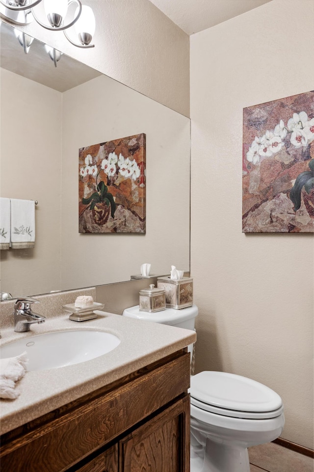 1010 Portesuello Ave, Santa Barbara, CA 93105 - half bath featuring vanity, toilet, and a chandelier