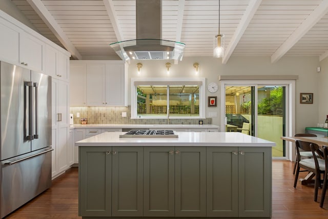 533 N La Cumbre Rd, Santa Barbara, CA 93110 - kitchen with high quality fridge, island exhaust hood, white cabinetry, gas stovetop, and wooden ceiling