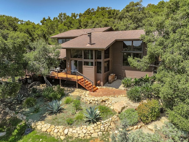 2031 Cielito Ln, Santa Barbara, CA 93105 - view of front of property featuring a deck, stairs, a shingled roof, and a sunroom