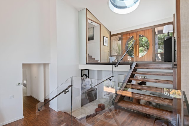 2031 Cielito Ln, Santa Barbara, CA 93105 - stairway featuring wood finished floors, high vaulted ceiling, and baseboards