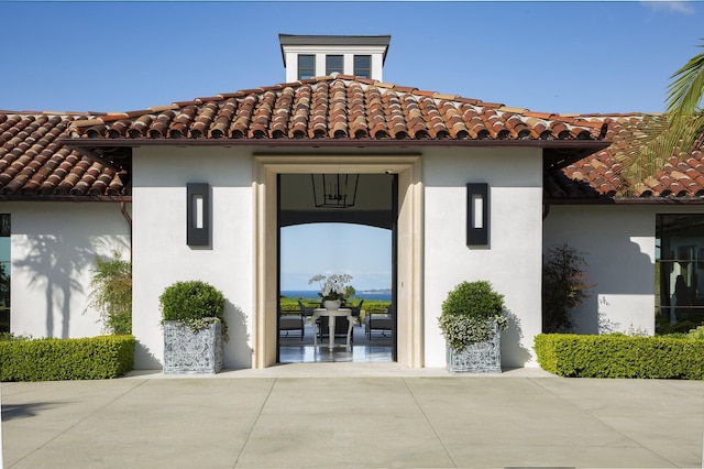 2720 Montecito Ranch Pl, Summerland, CA 93067 - view of exterior entry with stucco siding and a tile roof