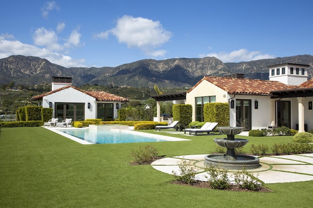 2720 Montecito Ranch Pl, Summerland, CA 93067 - back of house with a chimney, stucco siding, a mountain view, and a yard
