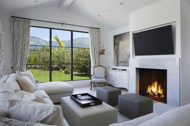 2720 Montecito Ranch Pl, Summerland, CA 93067 - living area with beam ceiling, a fireplace, and high vaulted ceiling