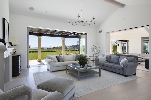 2720 Montecito Ranch Pl, Summerland, CA 93067 - living area featuring beamed ceiling, light wood-style flooring, a chandelier, and high vaulted ceiling